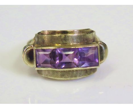 A Deco 8ct Yellow Gold and Amethyst Three Stone Ring, size M, 3.7g 