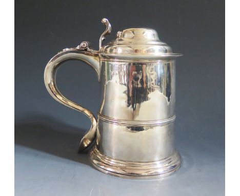 A George II Silver Lidded Tankard with scrolling thumb piece and contemporary initial M*M to the handle's shoulder, London 17