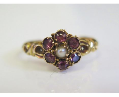 A 19ct Century Garnet and Pearl Cluster Ring in an unmarked gold setting, 9mm head, size N, 1.9g 