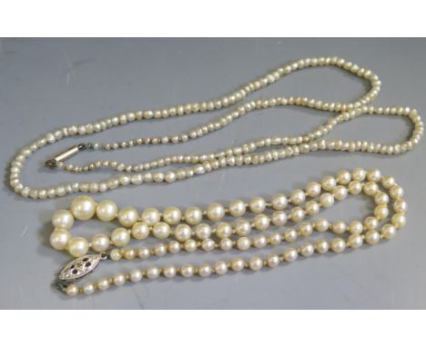 A 20.5" Antique Graduated Pearl Necklace with barrel clasp and another with 9ct white gold clasp 