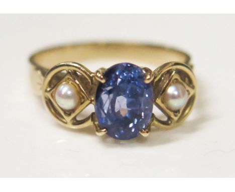 A 9ct Yellow Gold, Sapphire and Pearl Three Stone Ring in an openwork setting, sapphire c. 2.5ct, size N.5, 3.4g 