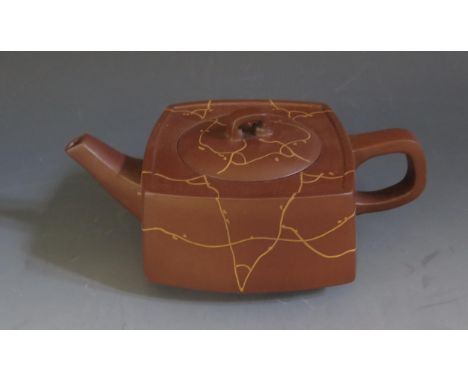 Chinese Yixing Pottery Teapot.  Slip decorated.  Impressed four character seal on the base and Lid.  18cm long. 