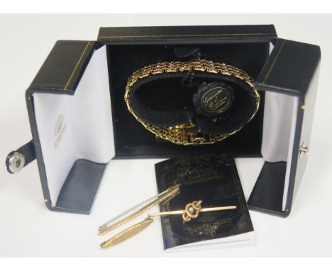 A 9ct Gold And Pearl Bar Brooch, 9ct gold brooch with engine turned decoration (3.2g) and unmarked 'DARLING' brooch (1.8g) an