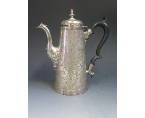 An Important Channel Islands Jersey Silver Coffee Pot with extensive chased foliate scroll and floral decoration, the base en