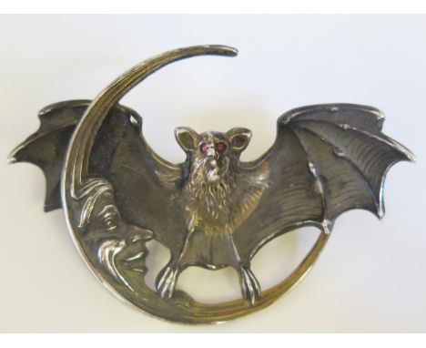 A Rare Unger Brothers Art Nouveau Silver Gilt Man in The Moon Bat Brooch with cabochon ruby eyes, stamped marks verso, 70mm t