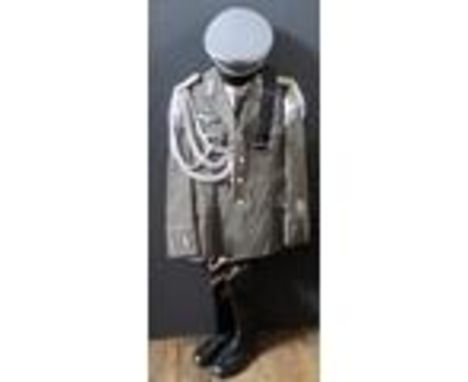 A G.D.R. Army Uniform, complete with tunic, shirt, tie, trousers, cap, belt and boots 