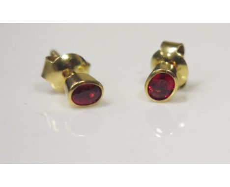 A Pair of 18ct Yellow Gold and Ruby Stud Earrings, 1.5g 