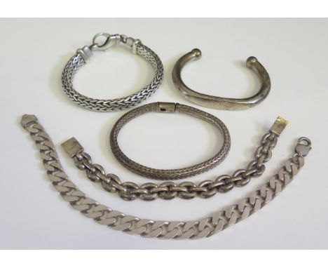 A Selection of Silver Jewellery including a torque bangle, flattened curb link bracelets etc., 306.6g 