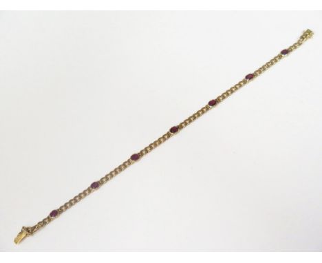 An 18ct Yellow Gold and Seven Stone Ruby 7" Curb Link Bracelet, 6.7g 