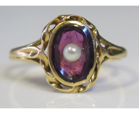 An Antique Amethyst and Seed Pearl Mounted Ring in an unmarked high carat gold setting, size K, 1.8g 