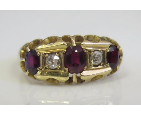An Antique 9ct Gold, Garnet and Diamond Five Stone Ring, Chester 1915, 28x8.5mm head, size K.5, 3.1g 