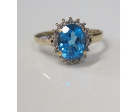 A 9ct Gold, Blue Topaz and Diamond Dress Ring, size R, 3.2g 