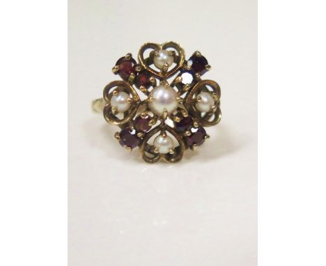 A 9ct Gold, Garnet and Pearl Cluster Ring, 19mm head, size O, 4.4g 