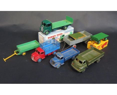 A Group of Dinky Toy Trucks and Trailers Including No. 513 Guy Flat truck (boxed), No. 429 Trailer (boxed), Dodge Stake Truck
