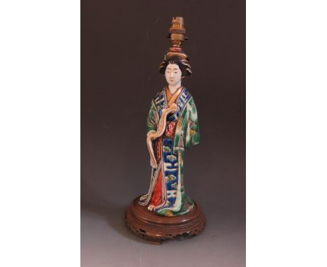 A Chinese Famille Vert Porcelain Female Figural Lamp holding a scroll, base of lamp with newspaper cutting of Sir Hall Caine 