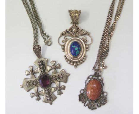 A Selection of Silver Jewellery including Indonesian made pendant (71mm), Jerusalem amethyst set cross and goldstone pendant,