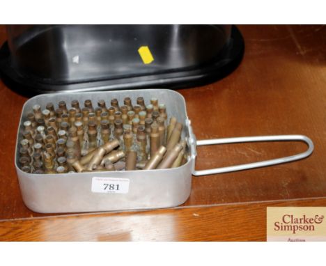 An army mess tin and quantity of brass bullet and shell cases