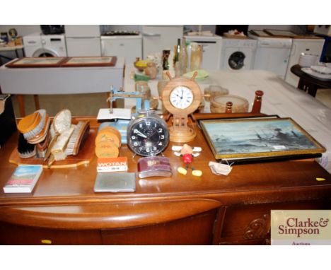 A quartz mantle clock in the form of a ships wheel, a child's Valcan tin plate sewing machine, a vintage alarm clock etc.
