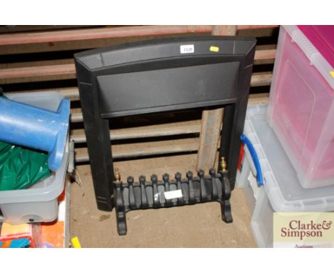 A modern cast iron surround and fire front