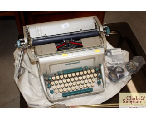 An Underwood typewriter and accessories