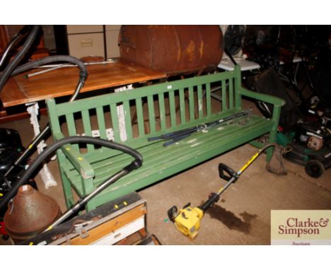 A green slatted garden bench AF