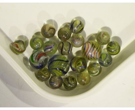 Twenty 19th century glass marbles with coloured spiral twist decoration, a House of Marbles bottle stopper, the finial formed