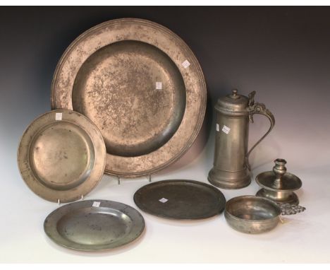 A group of pewter items, including a porringer with pierced handle, possibly 17th century, bearing label detailed 'Sotheby's.