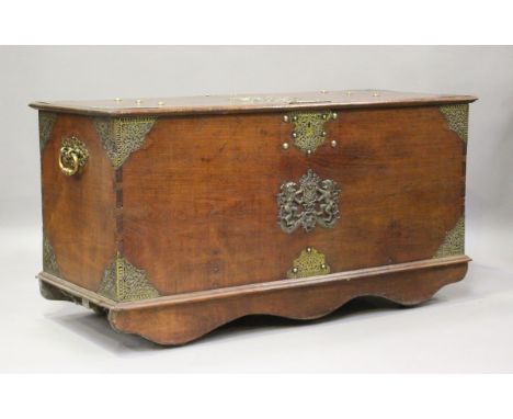 A late 19th/early 20th century Dutch Colonial teak trunk with overall pierced brass mounts and two Dutch East India Company '