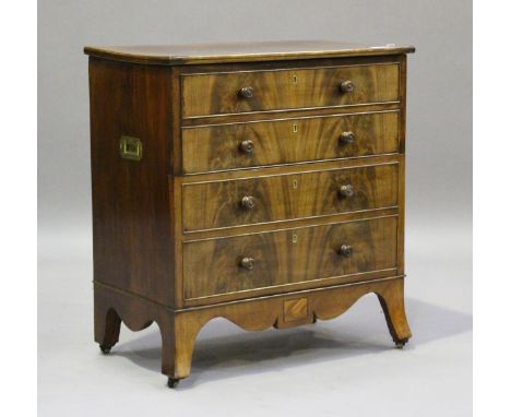 A George IV figured mahogany and rosewood crossbanded commode chest, the hinged lid and dummy front enclosing a blue and whit
