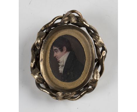 19th century British School - a watercolour portrait miniature of a gentleman in profile, 3cm x 2.5cm, mounted within a gilt 