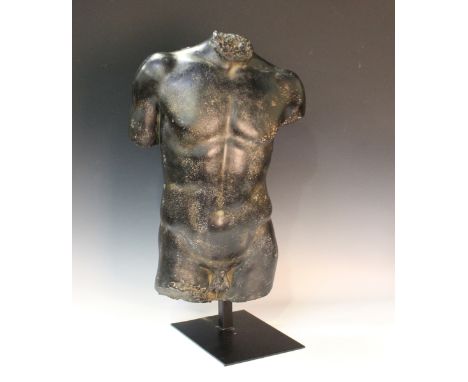 After the antique - a cast composition male torso, possibly Hermes, mounted on a black metal stand, height 69cm.Buyer’s Premi