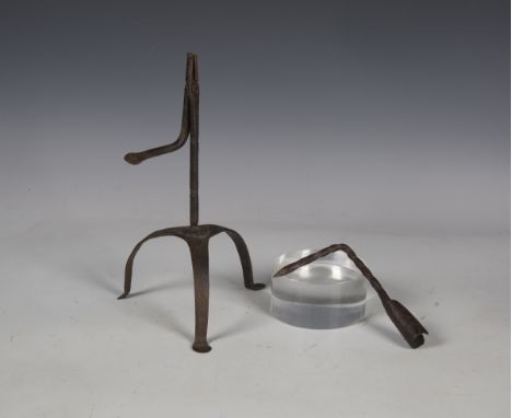 A wrought iron rush light, probably 17th century, raised on tripod supports, height 27cm, together with a wrought iron beam-m
