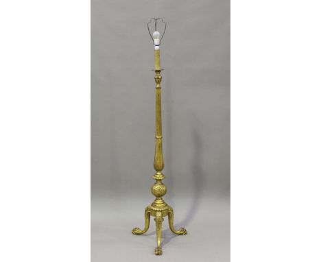 An early 20th century carved and gilded wood standard lamp with claw feet, height 139cm.Buyer’s Premium 29.4% (including VAT 