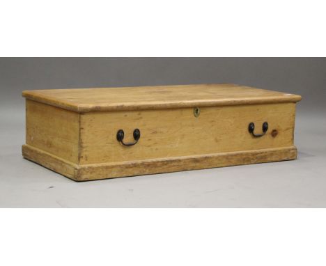 A late 19th century pine under-bed storage trunk, the hinged lid enclosing a croquet set, width 107cm, height 28cm.Buyer’s Pr