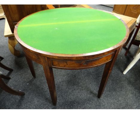 A walnut half-moon foldover card table with front drawer on tapered supports Condition reports provided on request by email f