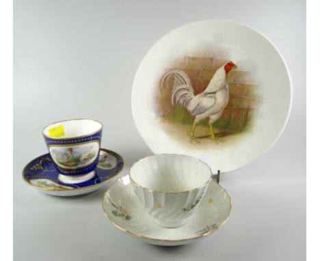 A Minton porcelain deep blue ground porcelain cup and saucer, decorated with panels of poultry and gilding, impressed mark to