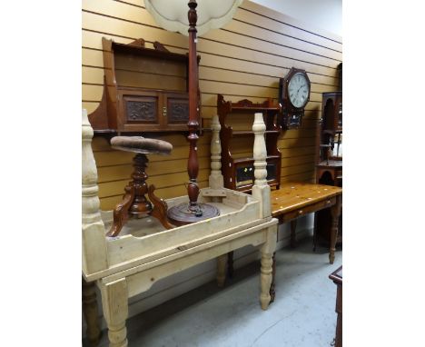 A parcel of furniture to include hanging trinket shelf with carved cupboards, honey pine table with drawer, circular music st