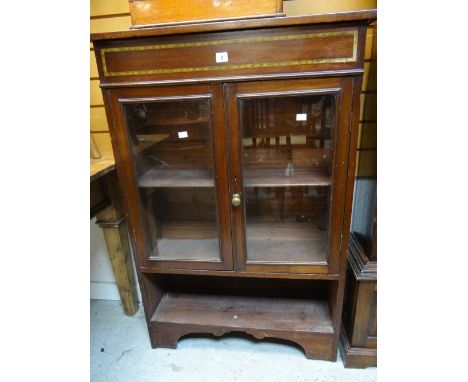 A vintage painted mahogany two-door glazed bookcase with lower open shelf Condition reports provided on request by email for 