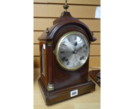 An Edwardian inlaid mahogany dome-top architectural-form bracket clock with gilt metal mounts and gilt finial, the circular s