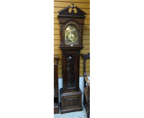 A reproduction oak encased grandfather clock with brass effect dial Condition reports provided on request by email for this a