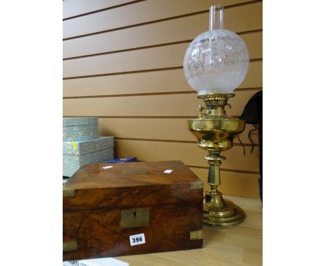 An antique brass oil lamp and a nineteenth century mahogany writing box Condition reports provided on request by email for th
