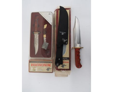 Three Winchester Commemorative Knives consisting unopened, limited edition 1895-2005 anniversary set of a small Bowie knife w