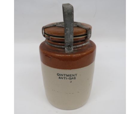 WW2 Anti Gas Ointment Stoneware Jar cream and brown glazed jar stamped “10-43” with maker “Doulton”. Black stencil to the fro