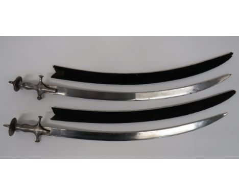 Two 19th Century Indian Tulwars consisting 29 1/4 inch, single edged, slightly curved blade.  One piece, steel hilt with quil