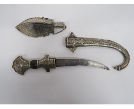 North African Jambiya and Powder Flask jambiya with 8 3/4 inch, double edged, slightly curved blade.  White metal crossguard 