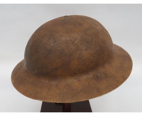 WW1 Brodie Pattern Steel Helmet khaki, rough, repainted crown with raw edge.  Inner brim stamped “FKS36”.  Black treated line