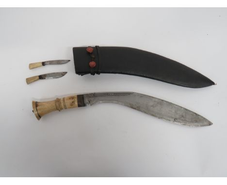 Indian Bone Hilted Kukri 11 3/4 inch, single edged blade of typical form. Edge with dot and line engraving. Brass ferrule. Bo