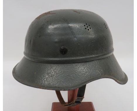 German Third Reich Gladiator Pattern Helmet grey painted crown with side vent holes.  Lower attached, two piece brim with sid