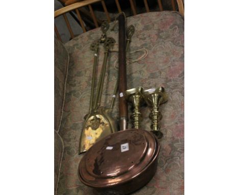 A pair of brass candlestick, copper warming pan and other items 