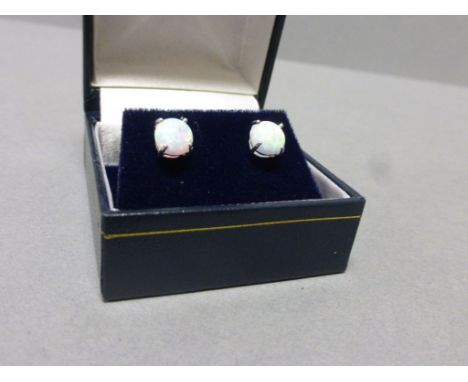 Pair of silver and opal stud earrings